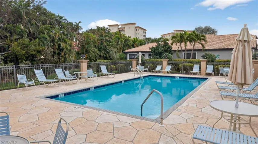 Community pool featuring a patio