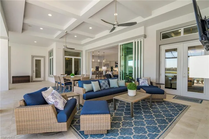 View of patio with ceiling fan, an outdoor hangout area, and french doors