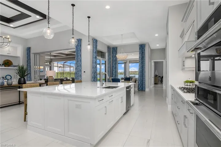 Huge kitchen island is perfect for entertaining and the heart of this home.