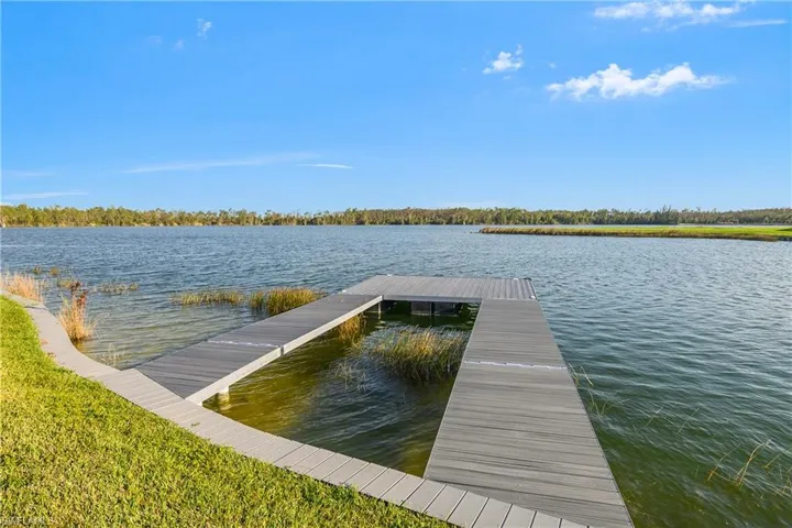Custom J & M composite dock, measures 16' x 20' and has 2 gangways.