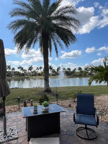 View of patio with a water view