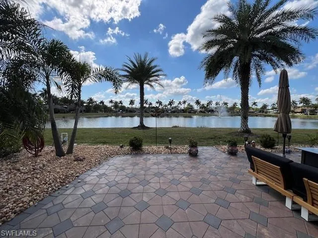 View of patio with a water view