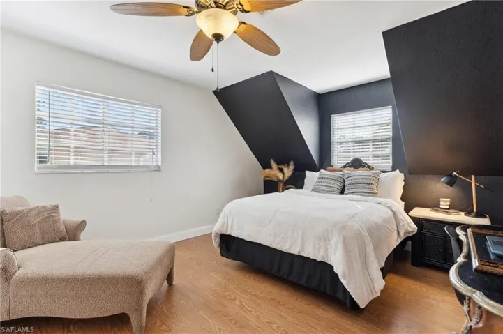 Bedroom with ceiling fan and light hardwood / wood-style flooring