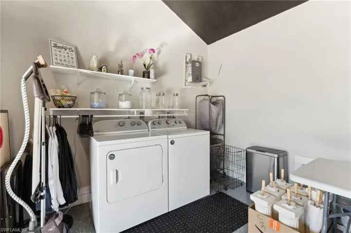 Washroom featuring independent washer and dryer