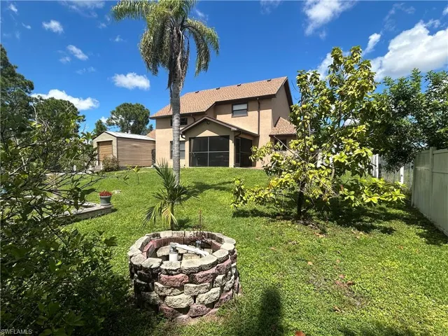 View of yard featuring an outdoor fire pit