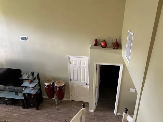 Stairway featuring wood-type flooring