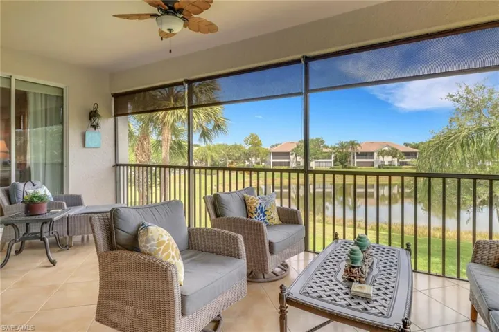 Sunroom / solarium with a ceiling fan, a balcony, and an outdoor living space