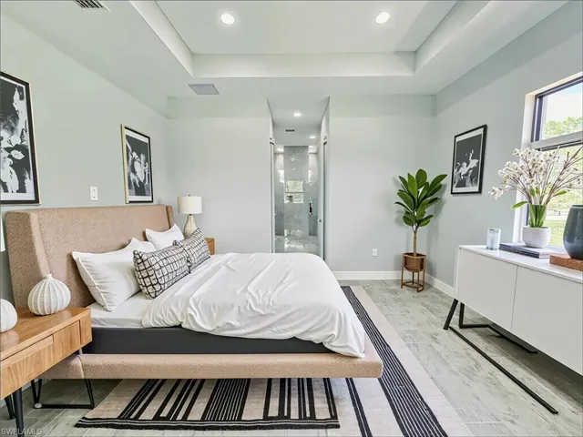 Bedroom featuring ensuite bathroom and recessed lighting