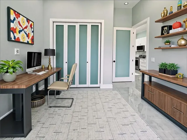 Office space with light marble finish floors and baseboards
