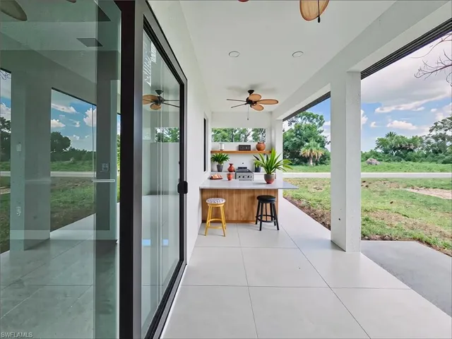View of patio / terrace featuring a ceiling fan and a grill