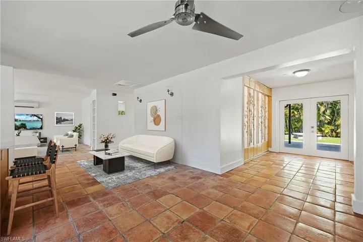 Open kitchen & great room to indoor laundry/yard