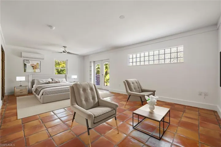 Primary bedroom doors to backyard