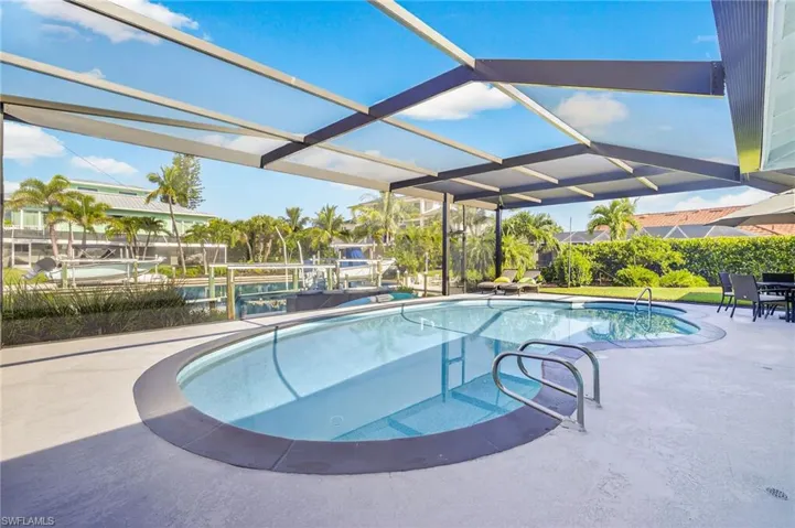 Swimming pool with a patio and a lanai