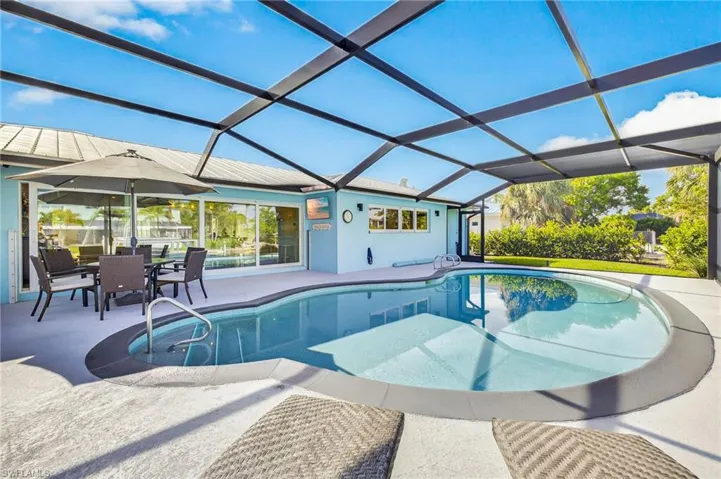 Swimming pool with a patio and a lanai