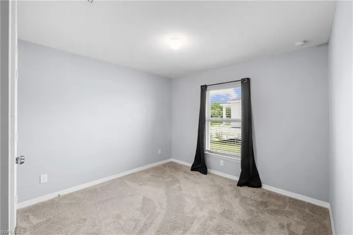 Bedroom #3 faces the side yard .. also makes for a terrific Home Office