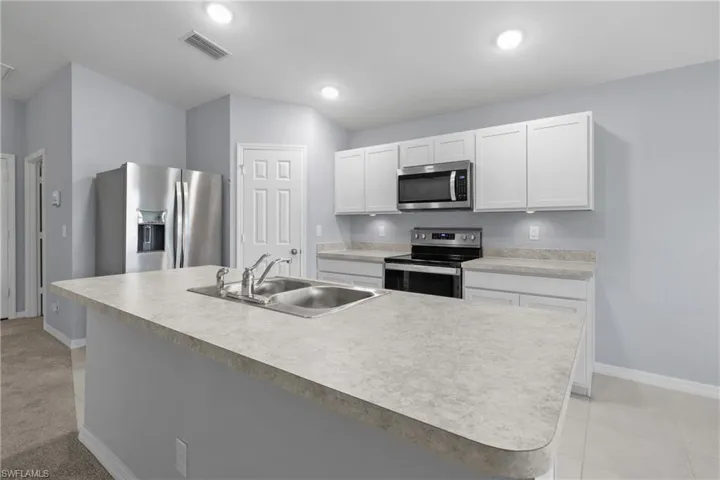 Light & Bright Kitchen with Large Pantry space to the right of Fridge