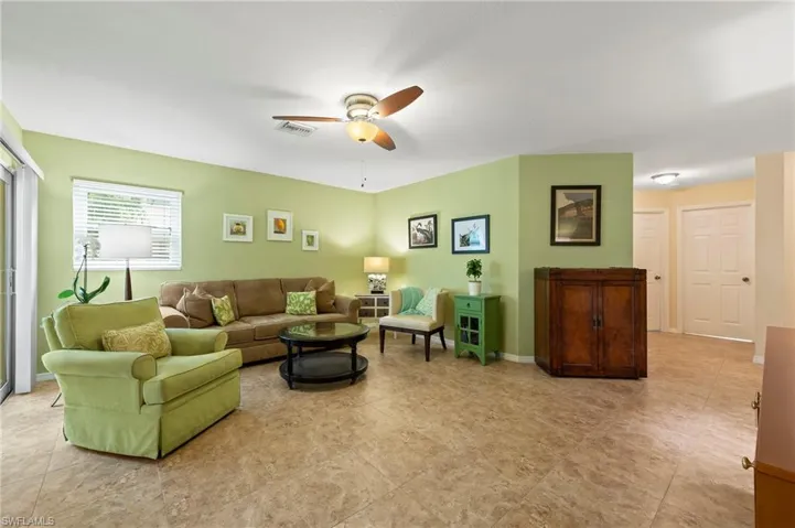 Living area pictured from primary bedroom angle