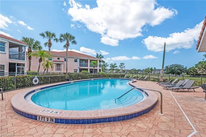 Pool featuring patio area and fence