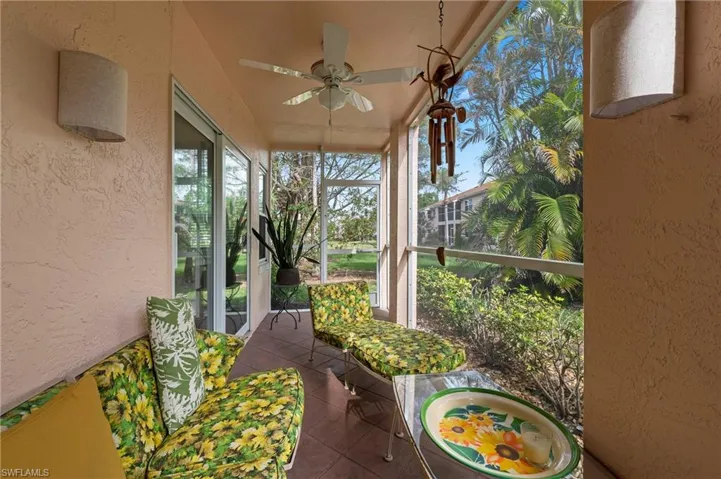 Lanai featuring tile patterned floors and a textured wall