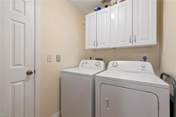 Clothes washing area, with separate washer and dryer and cabinet space