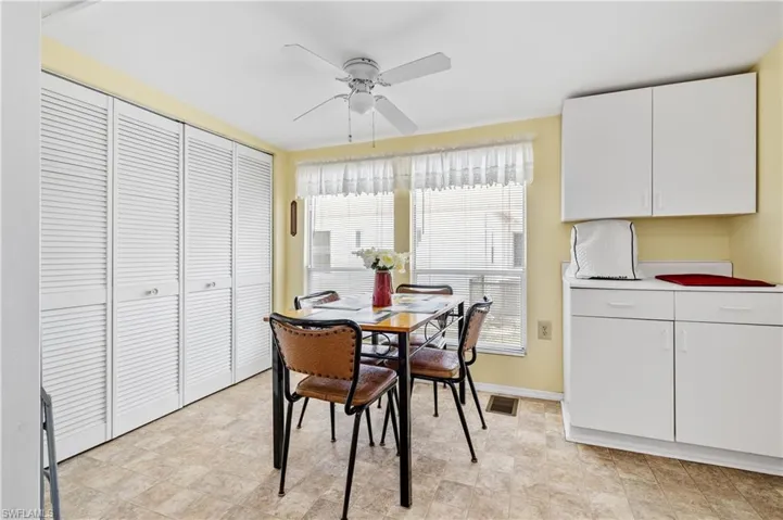 Dining room featuring ceiling fan and baseboards