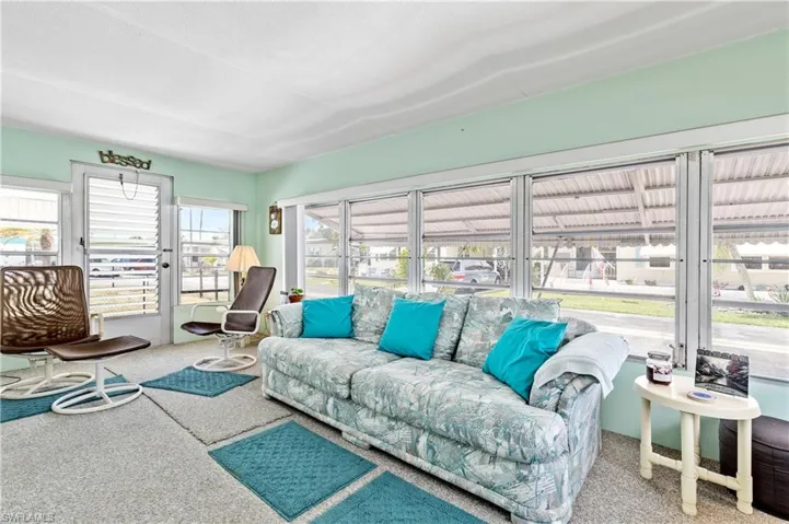 Living area featuring carpet flooring