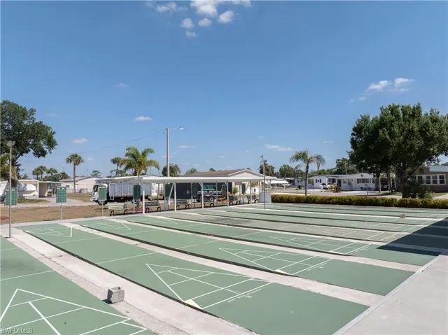 View of home's community featuring shuffleboard