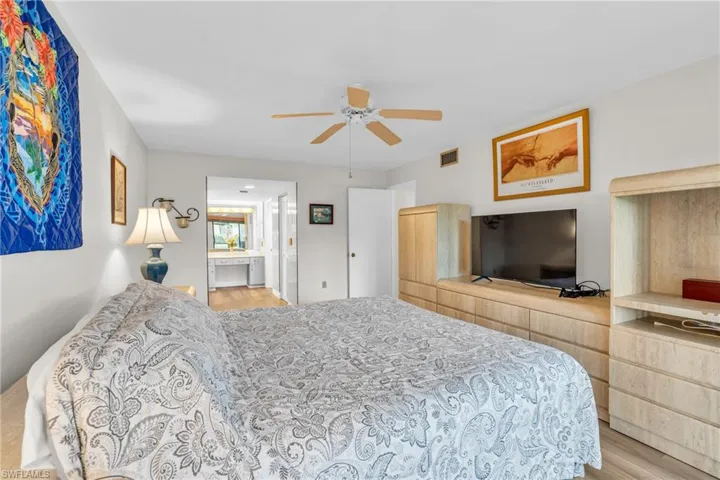 Bedroom suite with adjoining bathroom and walk in closet
