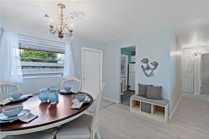 Dining space featuring a notable chandelier and light hardwood / wood-style floors