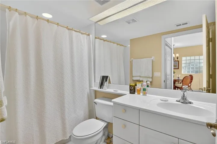 Bathroom with vanity and a shower with curtain