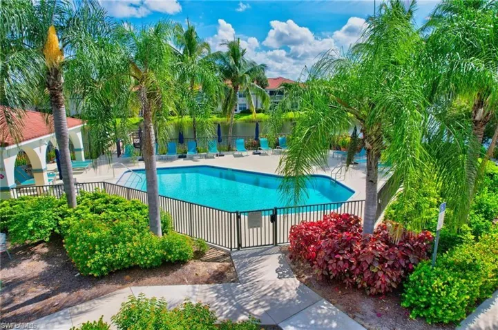 Community pool featuring a patio