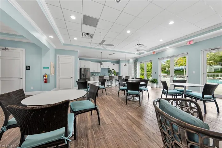 Spacious common area featuring wood-finish flooring and light blue walls