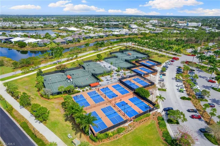 Aerial perspective showcasing multiple tennis courts and pickleball courts