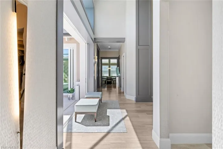 Bright interior hallway with wood-finish flooring extending throughout