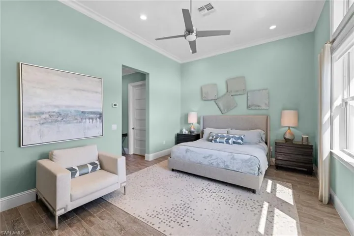 Bedroom #3 (detached casita) featuring wood-finish flooring, a contemporary ceiling fan, recessed lighting, and crown molding