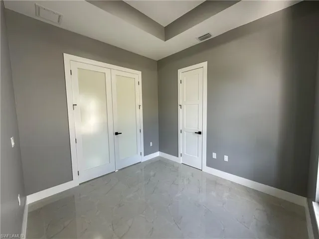 Unfurnished bedroom with a closet
