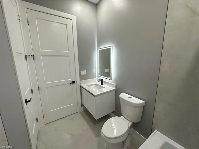 Bathroom featuring vanity and toilet