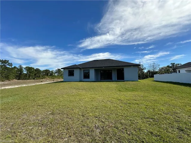 View of back of property and back yard