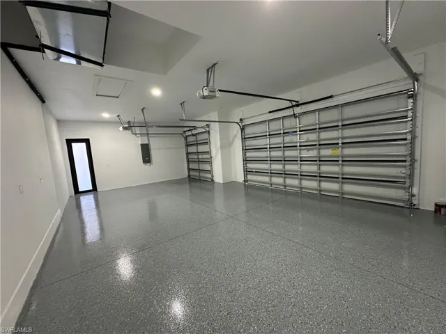 Garage featuring a garage door opener