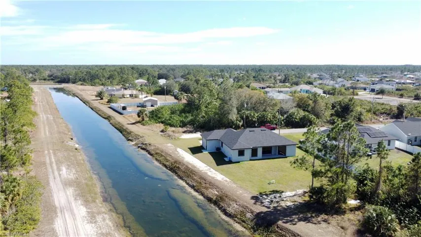 Bird's eye view with a water view and a view of the beach