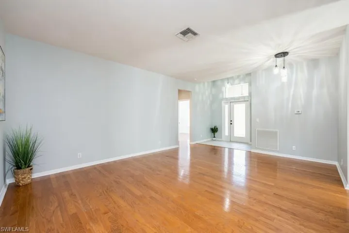 Unfurnished room with light hardwood / wood-style floors