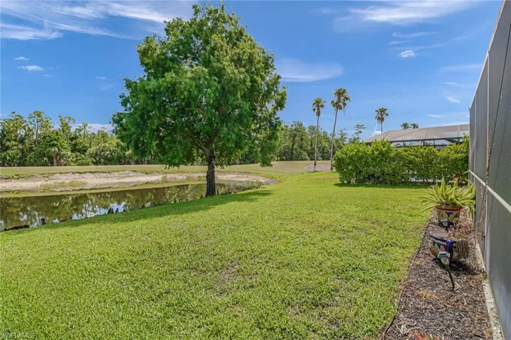 View of yard featuring a water view and golf course view