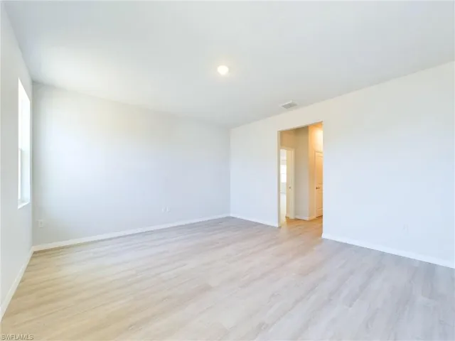 Empty room with light wood-type flooring