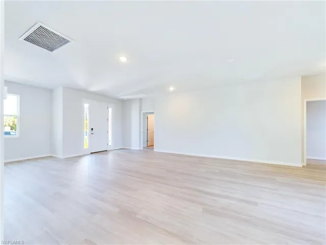 Unfurnished living room with light hardwood / wood-style floors