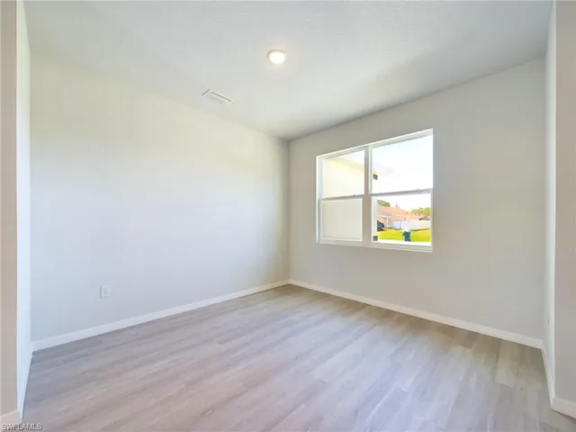 Unfurnished room featuring light hardwood / wood-style floors
