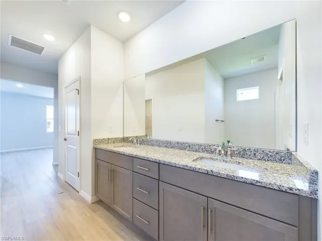 Bathroom featuring vanity and hardwood / wood-style flooring
