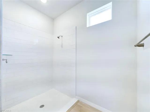 Bathroom featuring tiled shower