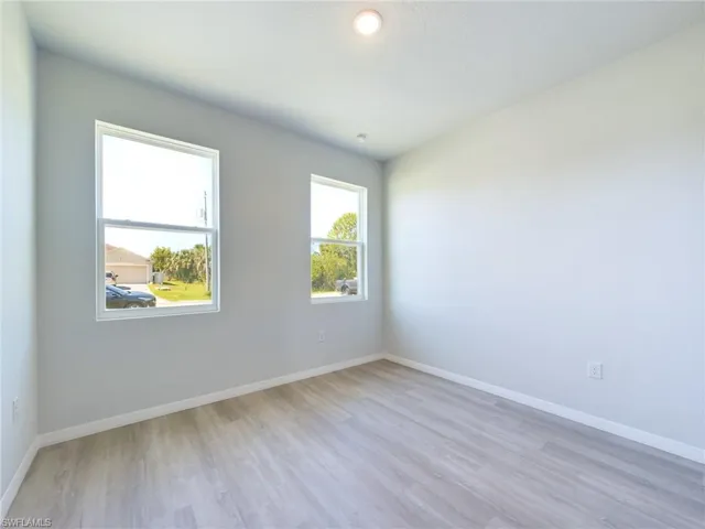 Empty room with light wood-type flooring