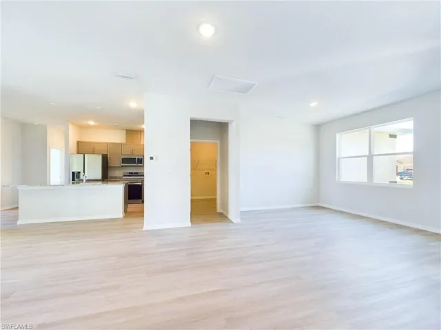 Unfurnished living room featuring light wood-type flooring