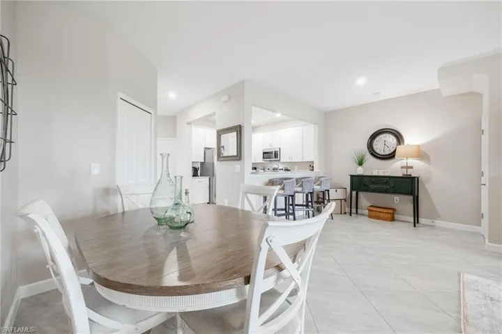 Dining room with light tile patterned flooring